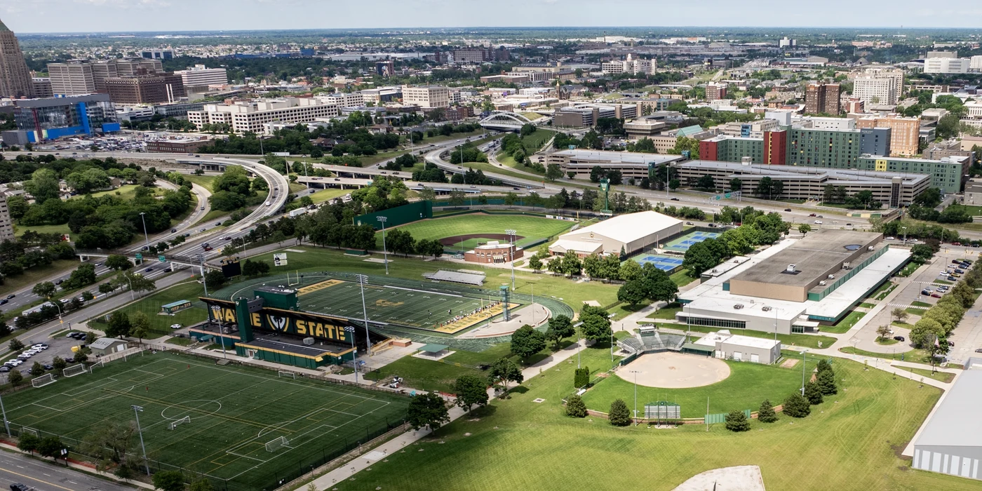 Aerial view of the Matthaei Athletic Complex at Wayne State University, with midtown Detroit behind it.